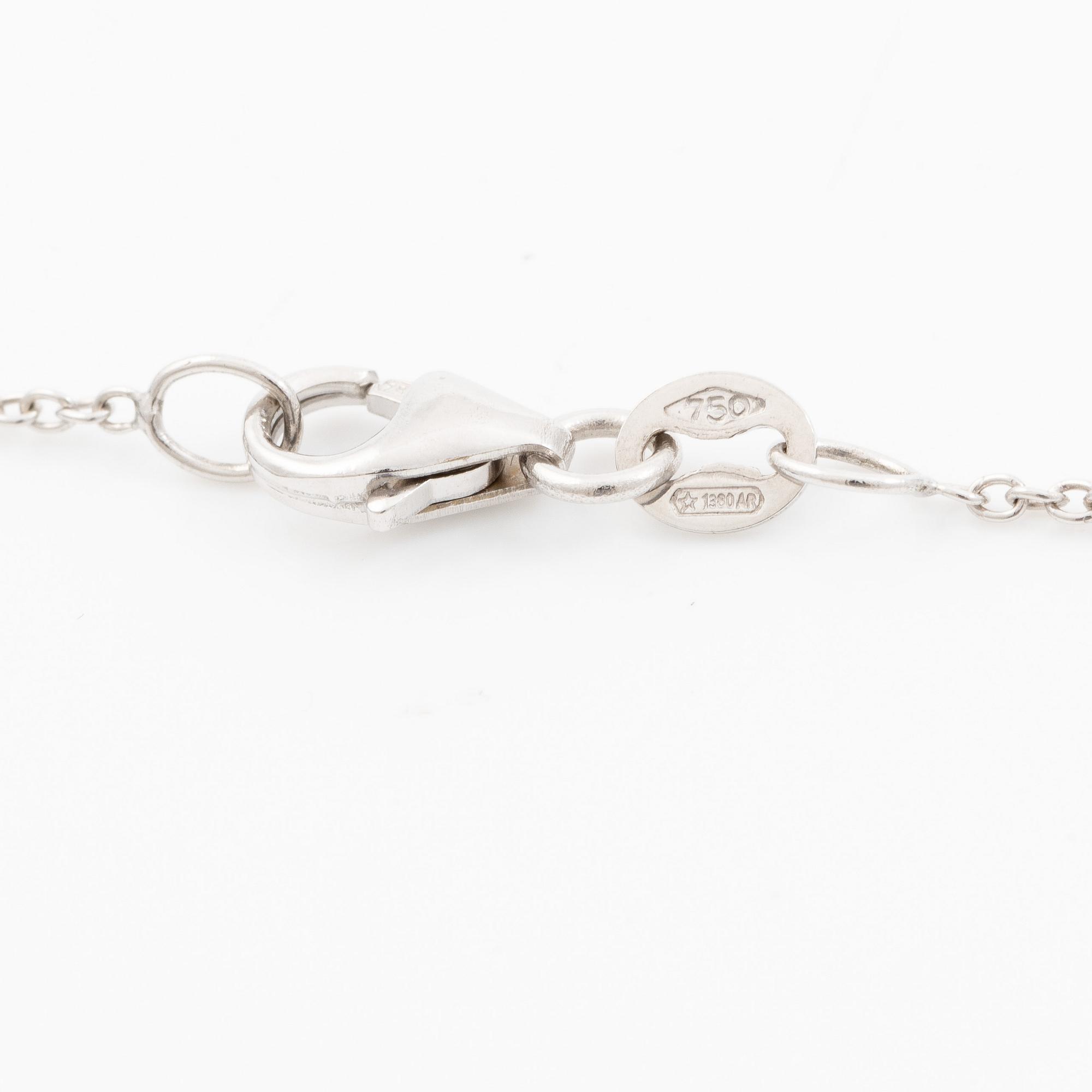 Pendant with chain in 18K white gold set with a faceted aquamarine and round brilliant-cut diamonds.