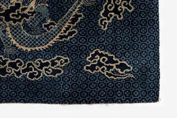A Chinese 'dragon' rug, circa 1920. (c 190x122 cm).