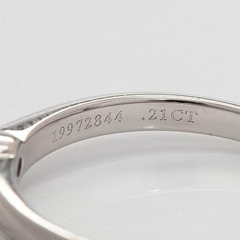 Tiffany & Co, a platinum solitaire ring with a brilliant-cut diamond.