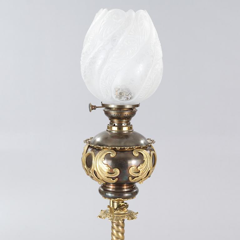 Two floor parafine lamps, 20th century.
