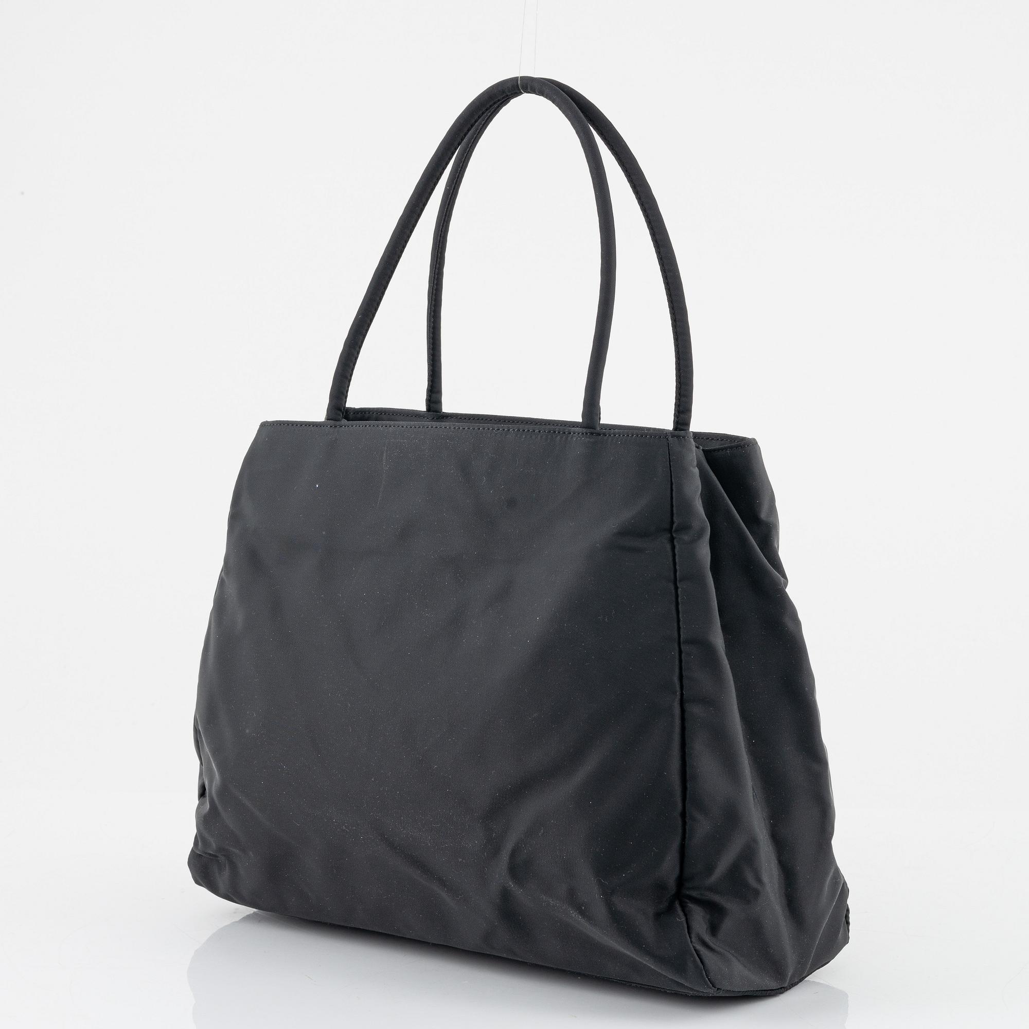 Prada, a black nylon handbag.