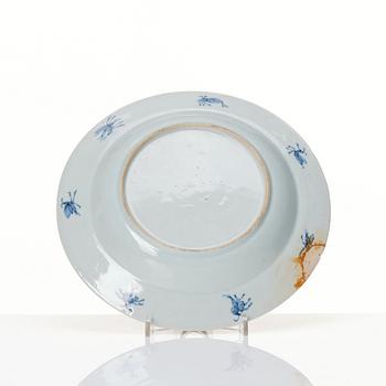 Chinese Imari ’Dame au Parasol’ plate decorated in underglaze blue, iron-red and gilt, Qing dynasty, Qianlong 1730-40.