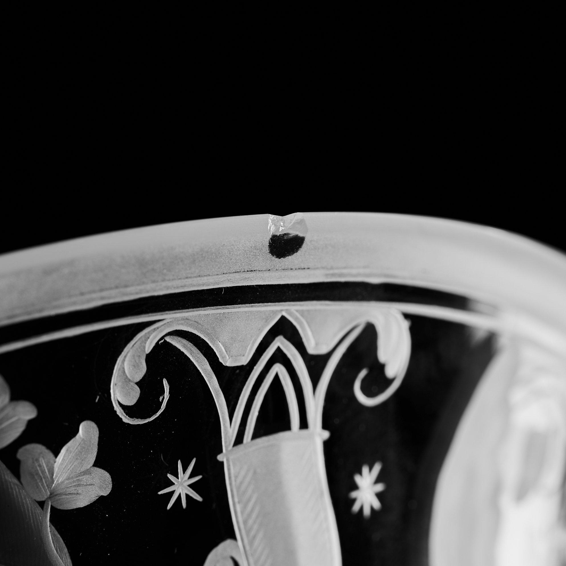 Simon Gate, a Swedish Grace engraved glass bowl with stand, Orrefors 1930, model 147, engraved by Karl Rössler.