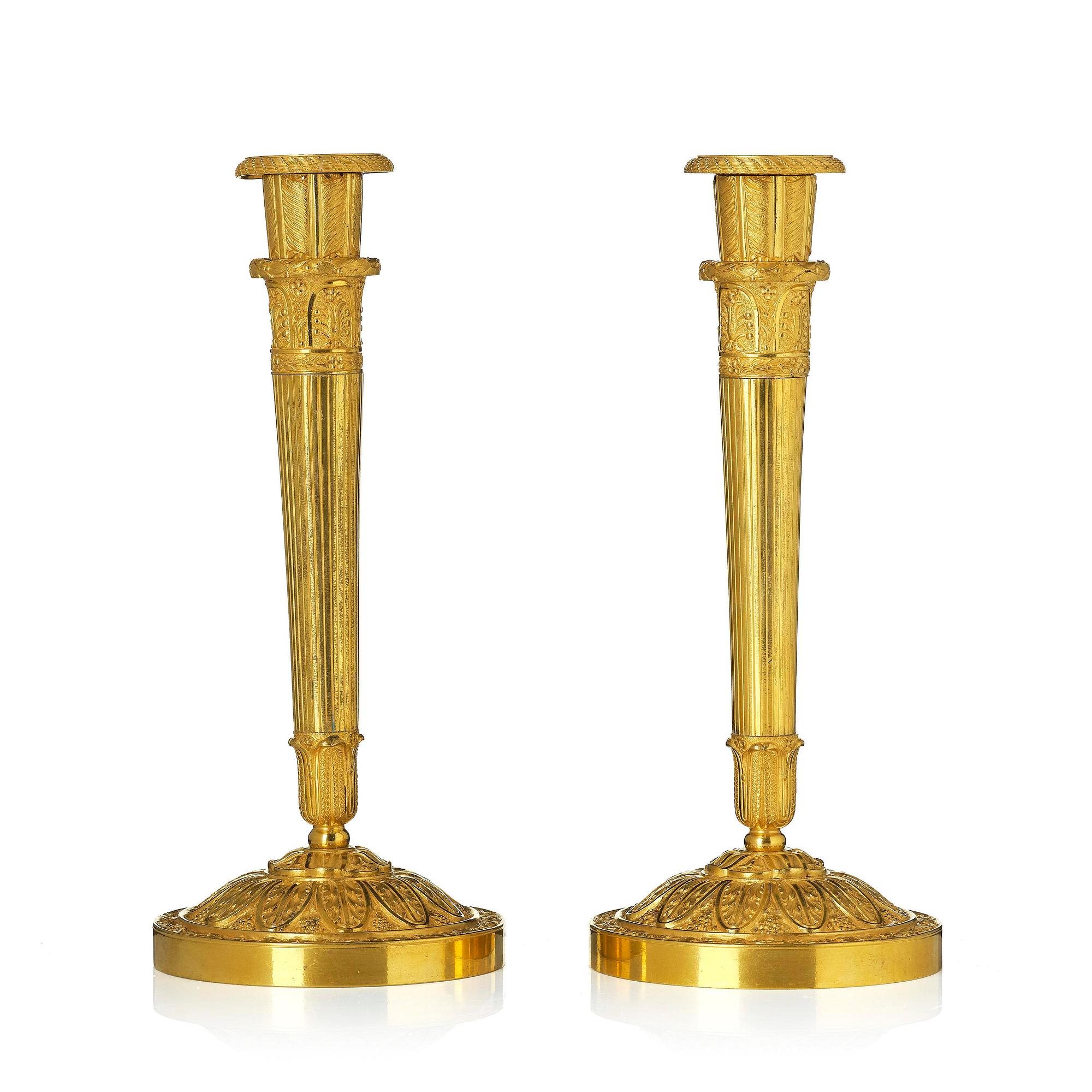 A pair of Empire ormolu candlesticks.