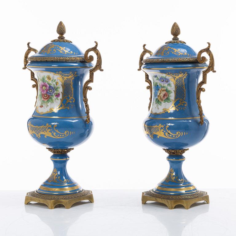 Decorative urns, a pair, porcelain, Sevres-like mark, circa 1900.