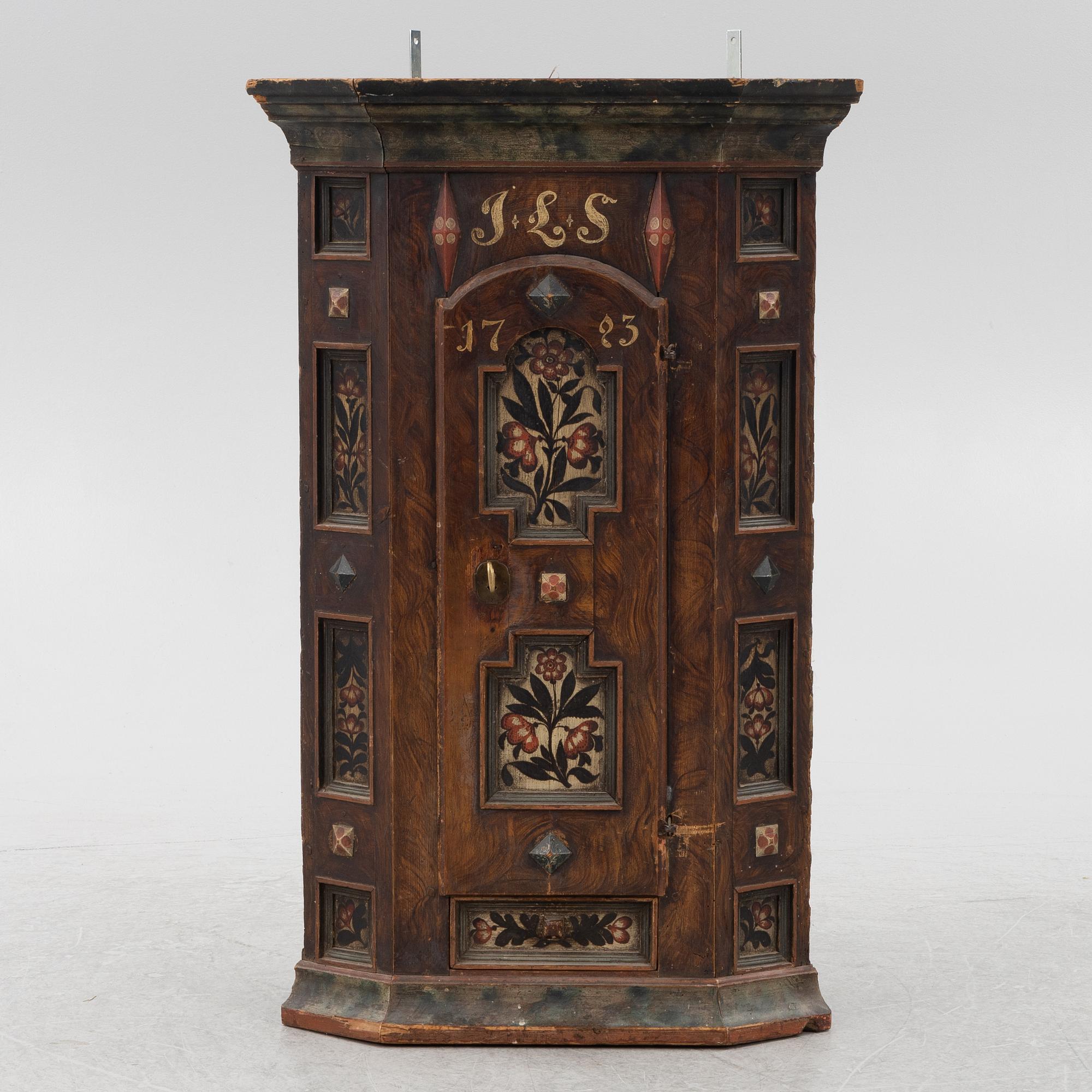 A Swedish painted corner cupboard, 18th Century.