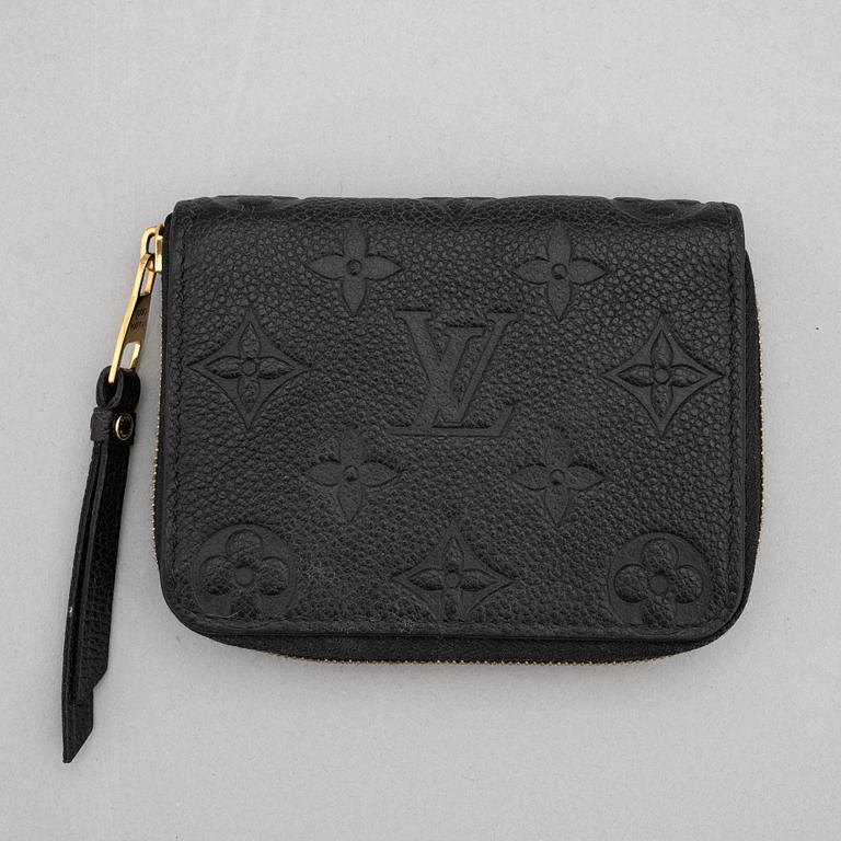 Louis Vuitton, a black, embossed leather wallet, 2015.