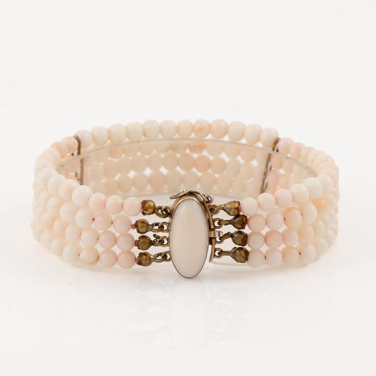 Bracelet with light pink coral, four strands.