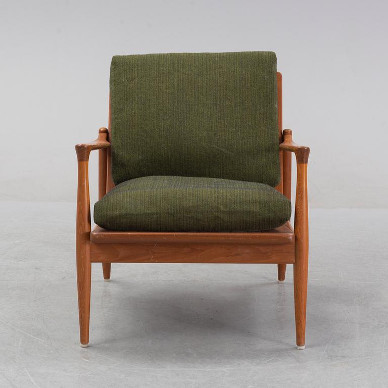 A 1950's/60's teak and oak easy chair.