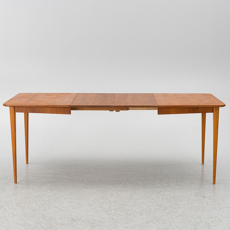 A mid20th century dining table.