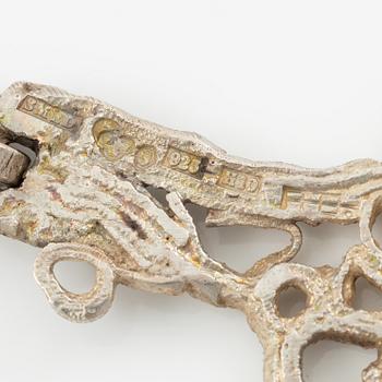 Lars Arby, three neck rings and two pendants, silver with enamel.