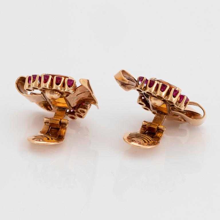 A pair of 18K gold earrings set with faceted citrine and rubies.