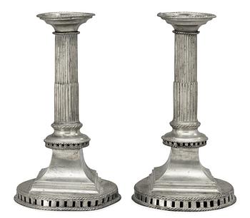 633. A matched pair of late Gustavian pewter candlesticks by G. F. Baumann.