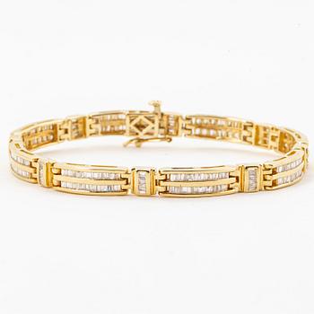 14K gold and small modified baguette cut diamond bracelet.