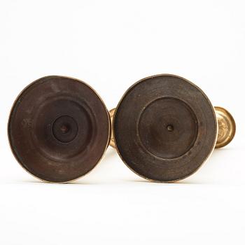 A pair of Empire early 19th century candlesticks.