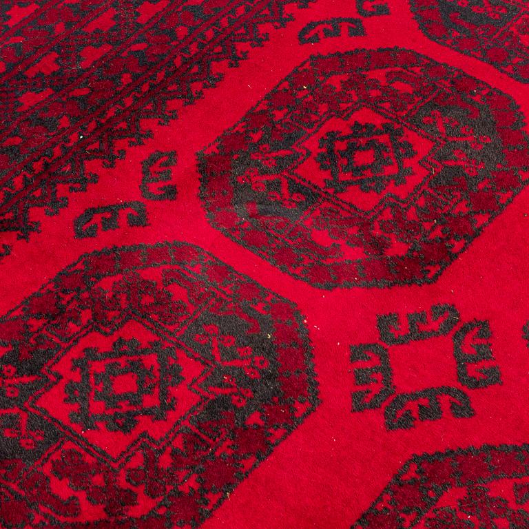 Two Afghan carpets. Ca. 326 x 217 and 88 x 63 cm.