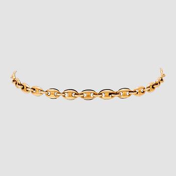 An 18K gold bracelet by Cartier.