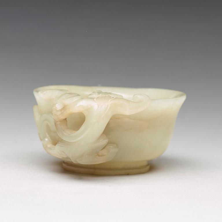 A carved nephrite Qilong goblet, Qing dynasty (1644-1912).