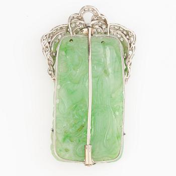 Brooch, platinum with carved jade and octagon-cut diamonds.
