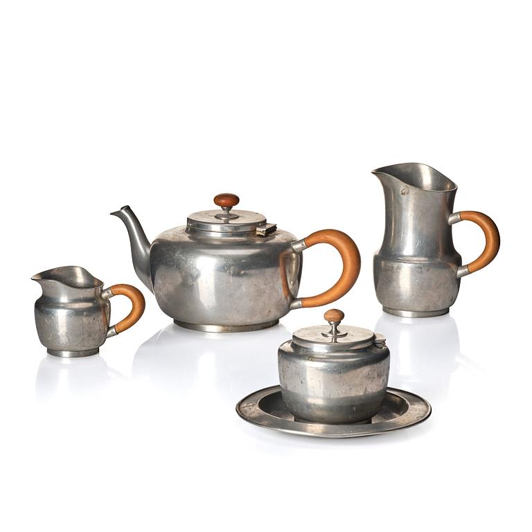 Josef Frank, a four-piece pewter tea set and a plate, model "A2330", Firma Svenskt Tenn, Stockholm 1946 (plate 1929).