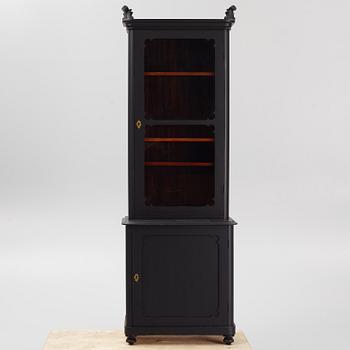 A display cabinet, late 20th Century.