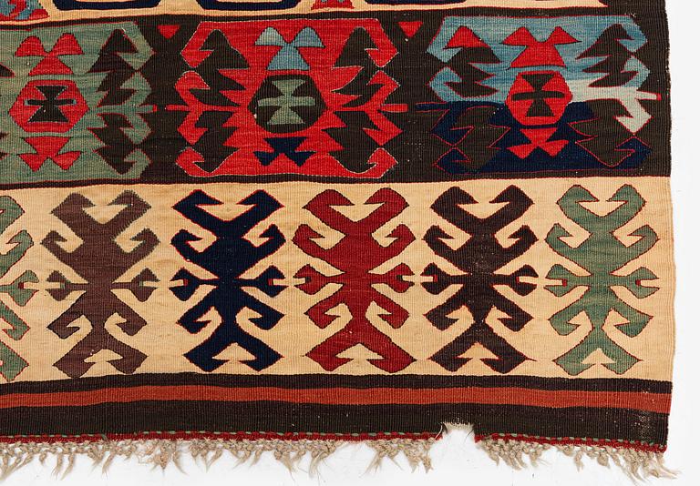 An antique Central Anatolian kilim, c. 273 x 101 cm.