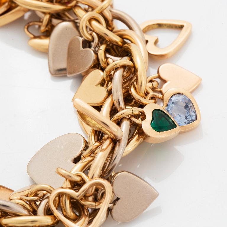 An 18K gold Gaudy bracelet with heart shaped charms.