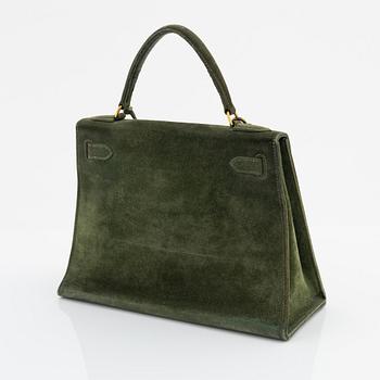 Hermès, a 1960's green suede 'Kelly 30'.