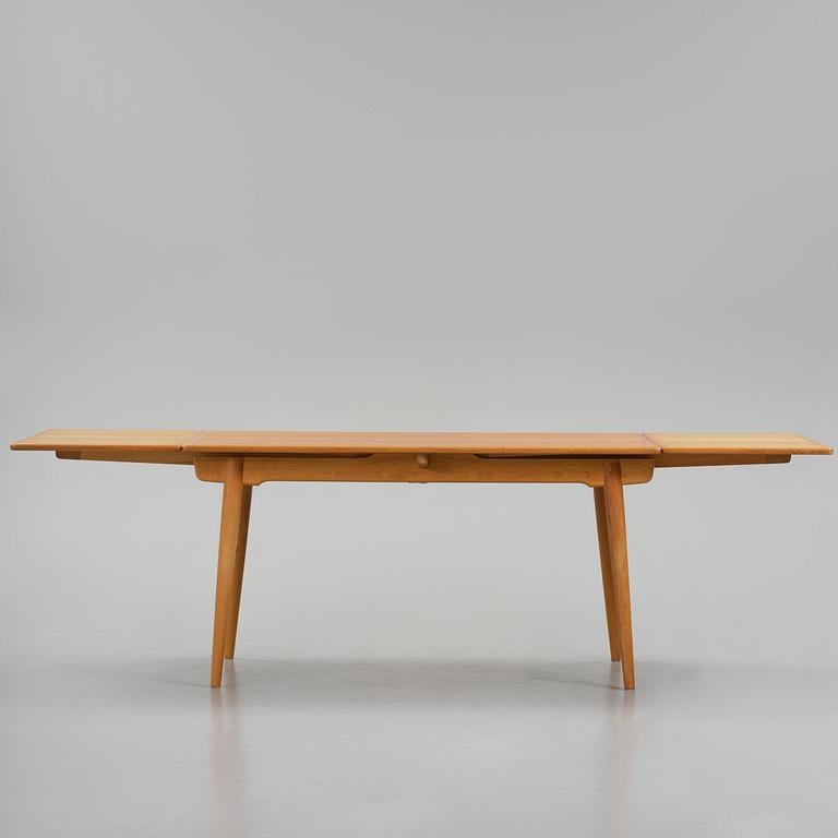 Hans J. Wegner, an "AT-312" dining table, Andreas Tuck, Denmark, 1950s-60s.