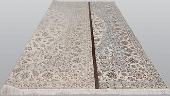 A Nain part silk carpet, 408 x 308 cm.