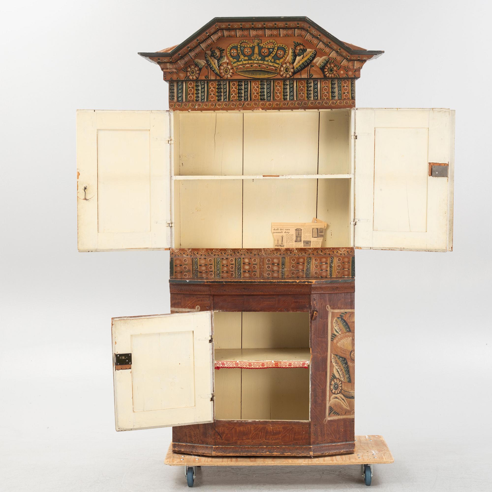 A Swedish traditional painted cabinet, dated 1819.