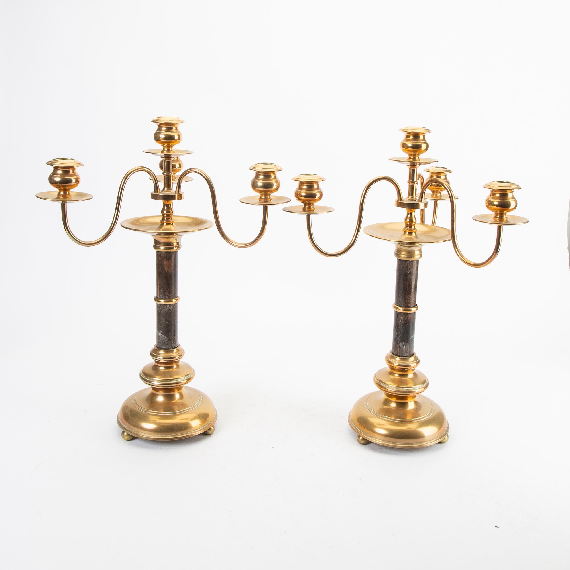 A pair of brass and wood candelabras early 1900s.