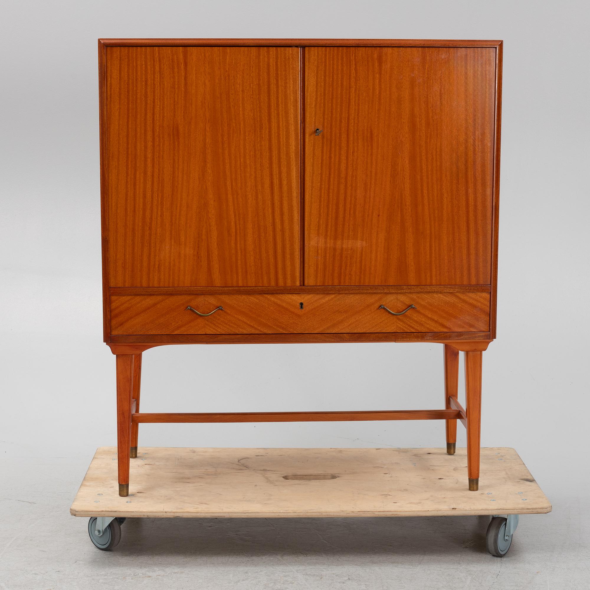 A mahogany veneered cabinet, 1940s/50s.