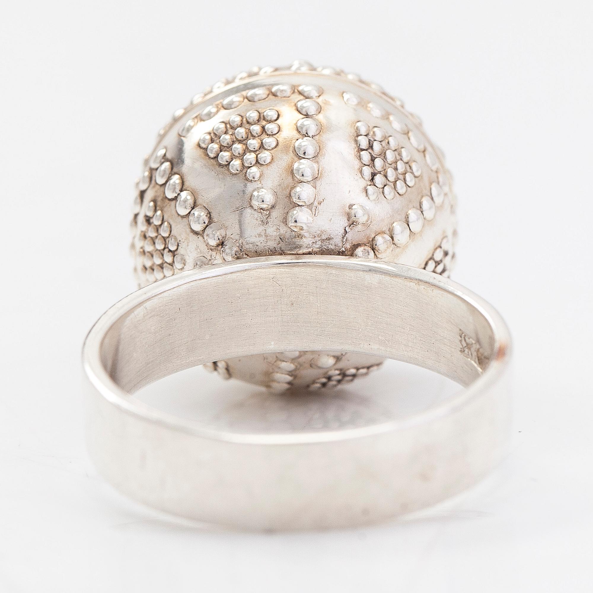 A set of silver "Halikko treasure" necklace, bracelet, ring and earrings. Kalevala Koru, Helsinki 1965-1972.