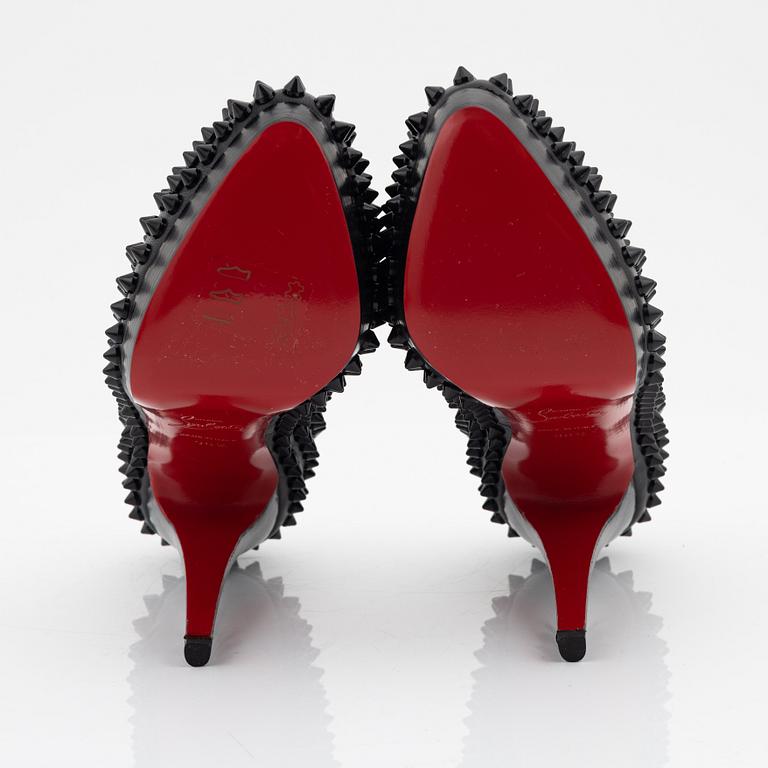 Christian Louboutin, a pair of black leather and studs pumps, size 36 1/2.