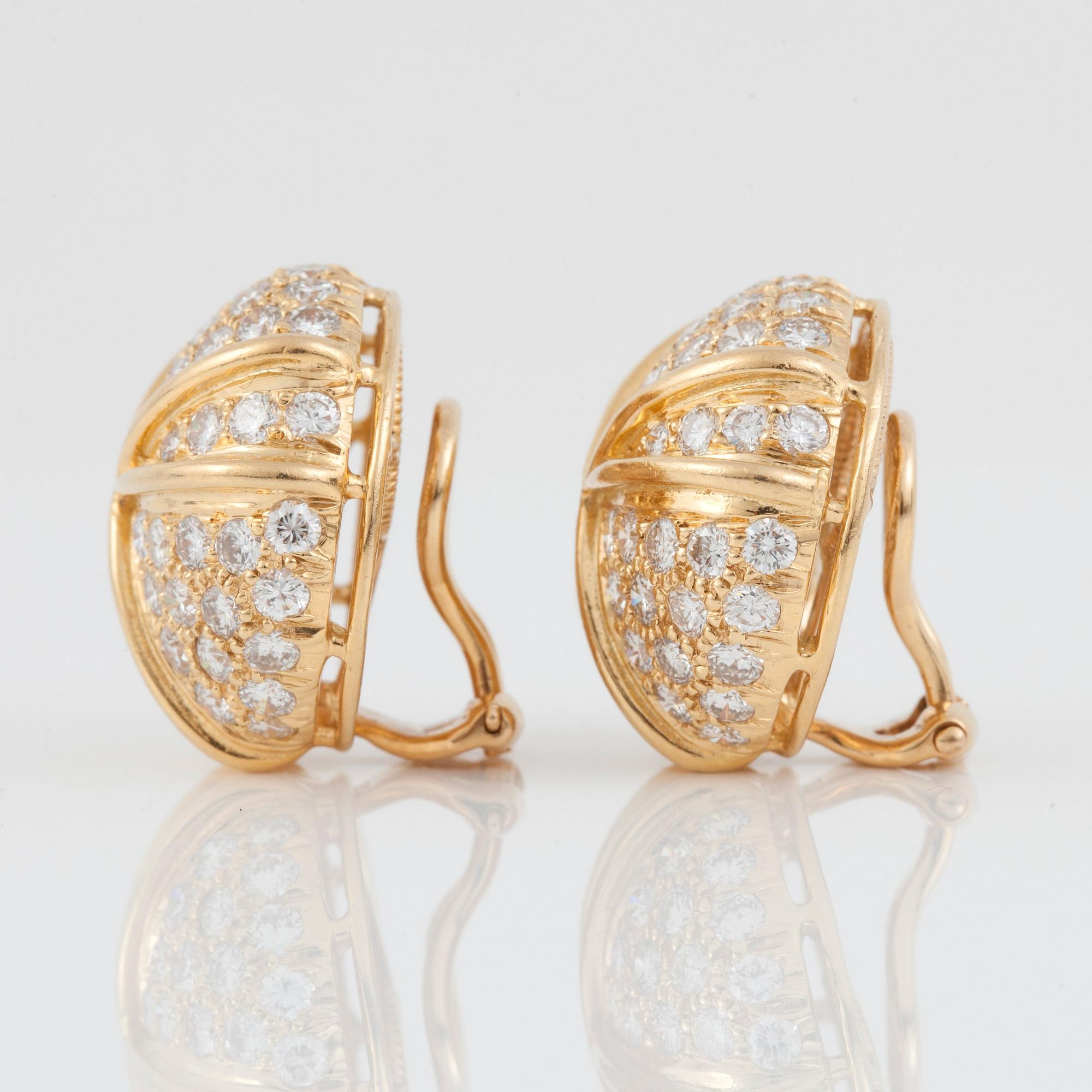 A pair of brilliant-cut diamond earrings. Diamond total carat weight circa 3.50 cts.  Signed Harry Winston.