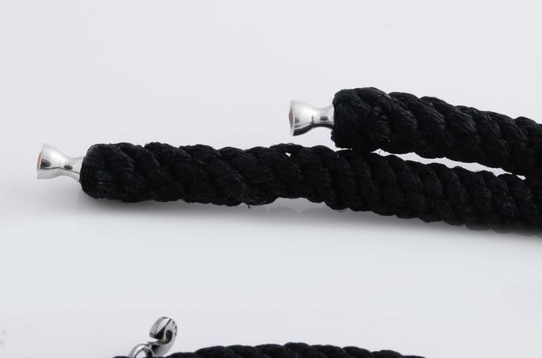 A bracelet, necklace and a clasp by Ole Lynggaard.