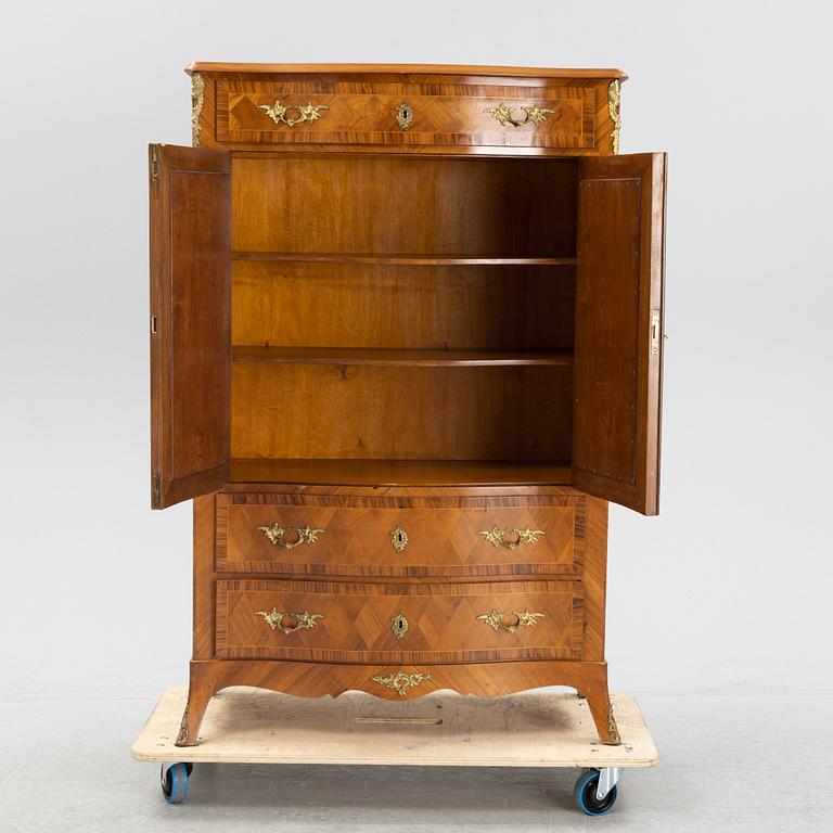 A walnut veneered Louis XV style cabinet, early 20th Century.