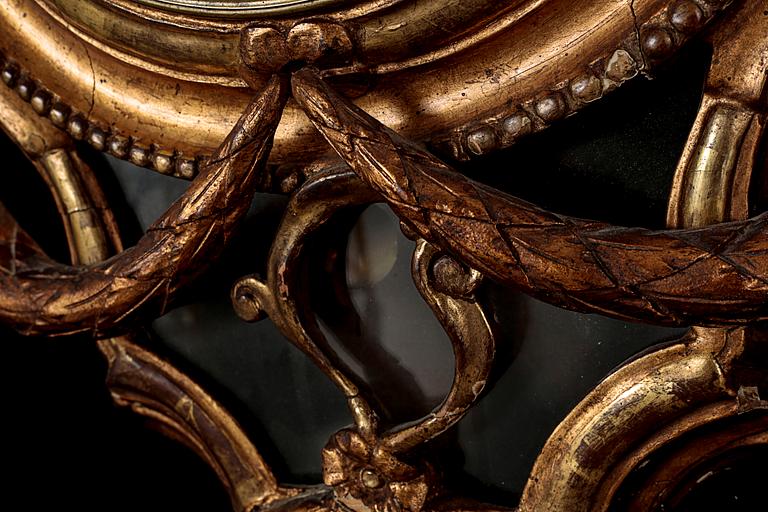 A Gustavian wall hanged clock, dial marked "Jacob Kock Stockholm", maded in the second half of the 18th century.