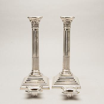 A pair of classical column sterling silver candlesticks Birmingham, 1934, by 'B.G. & Co'.
