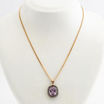 Pendant, 18k gold with diamonds and purple stone.