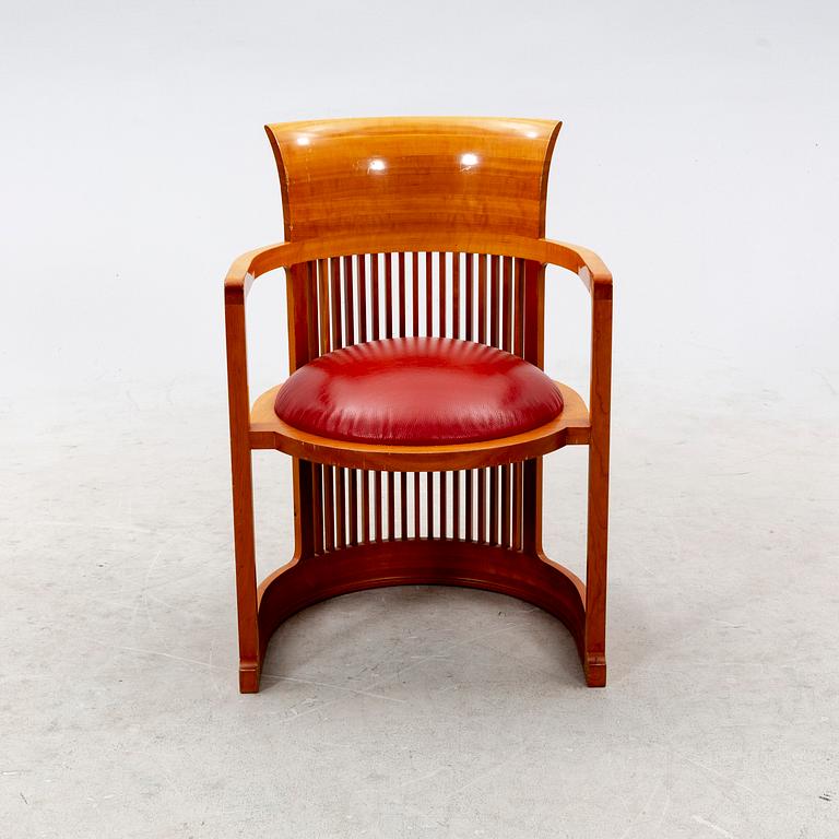 A cherry wood model 606 'Barrel' chair by Frank Lloyd Wright from Cassina.
