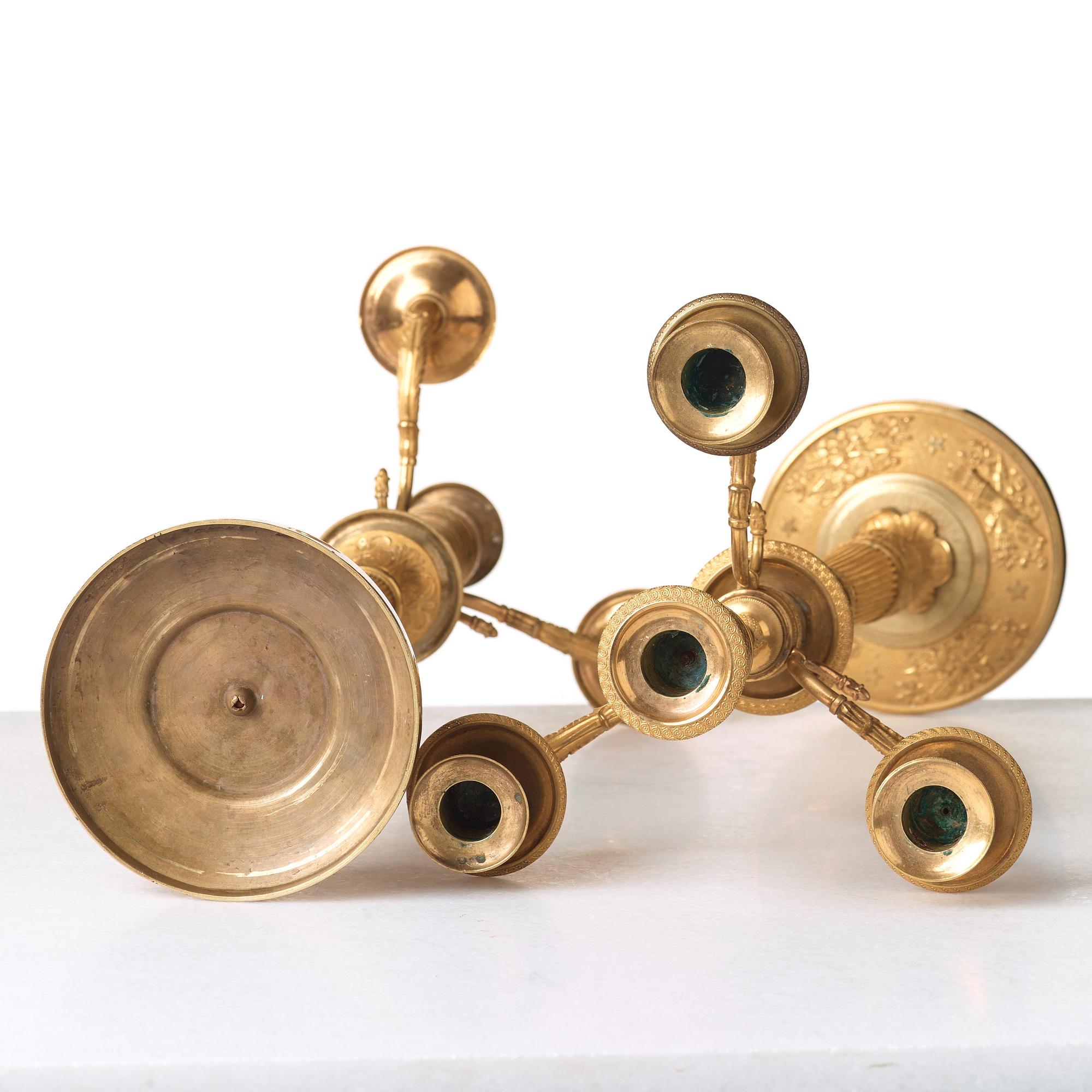 A pair of Empire early 19th century gilt bronze four-light candelabra.