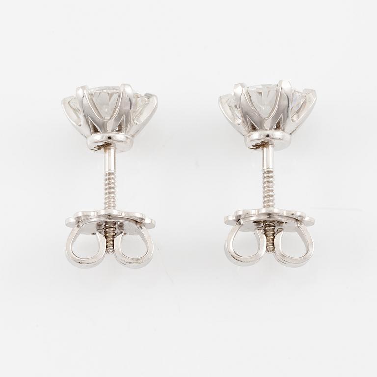 Brilliant-cut diamond stud earrings.