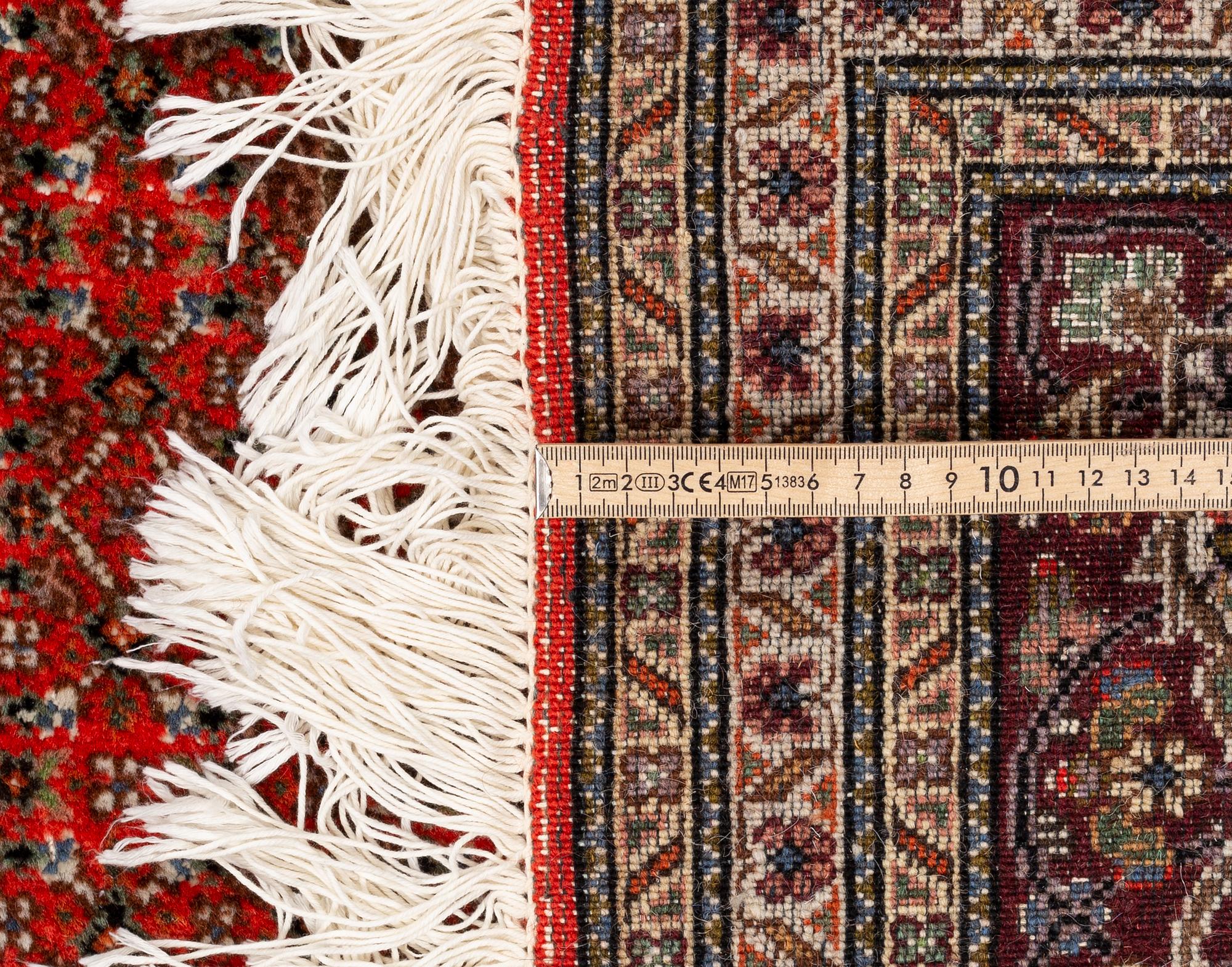 A carpet, Tabriz, part silk, 40-50 Radj, ca 300 x 195 cm.