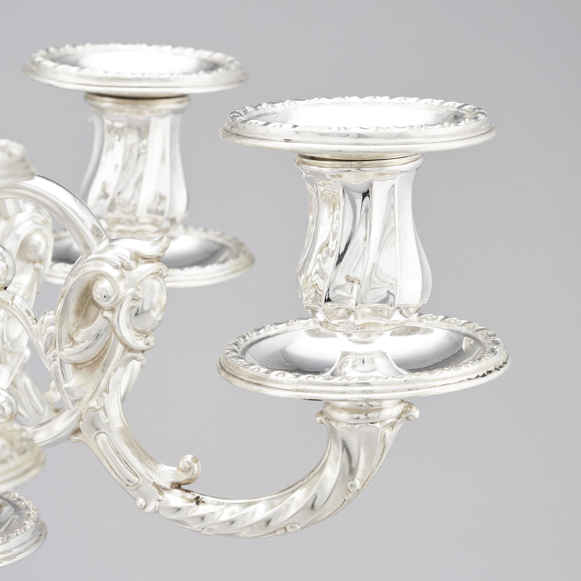A pair of Swedish silver candelabra, mark of Gustaf Möllenborg (Carl Teodor Feron), Stockholm 1896.