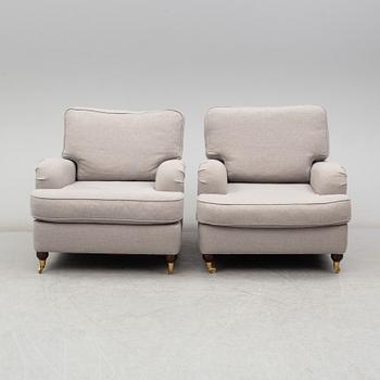 A 21st Century pair of Howard lounge chairs.