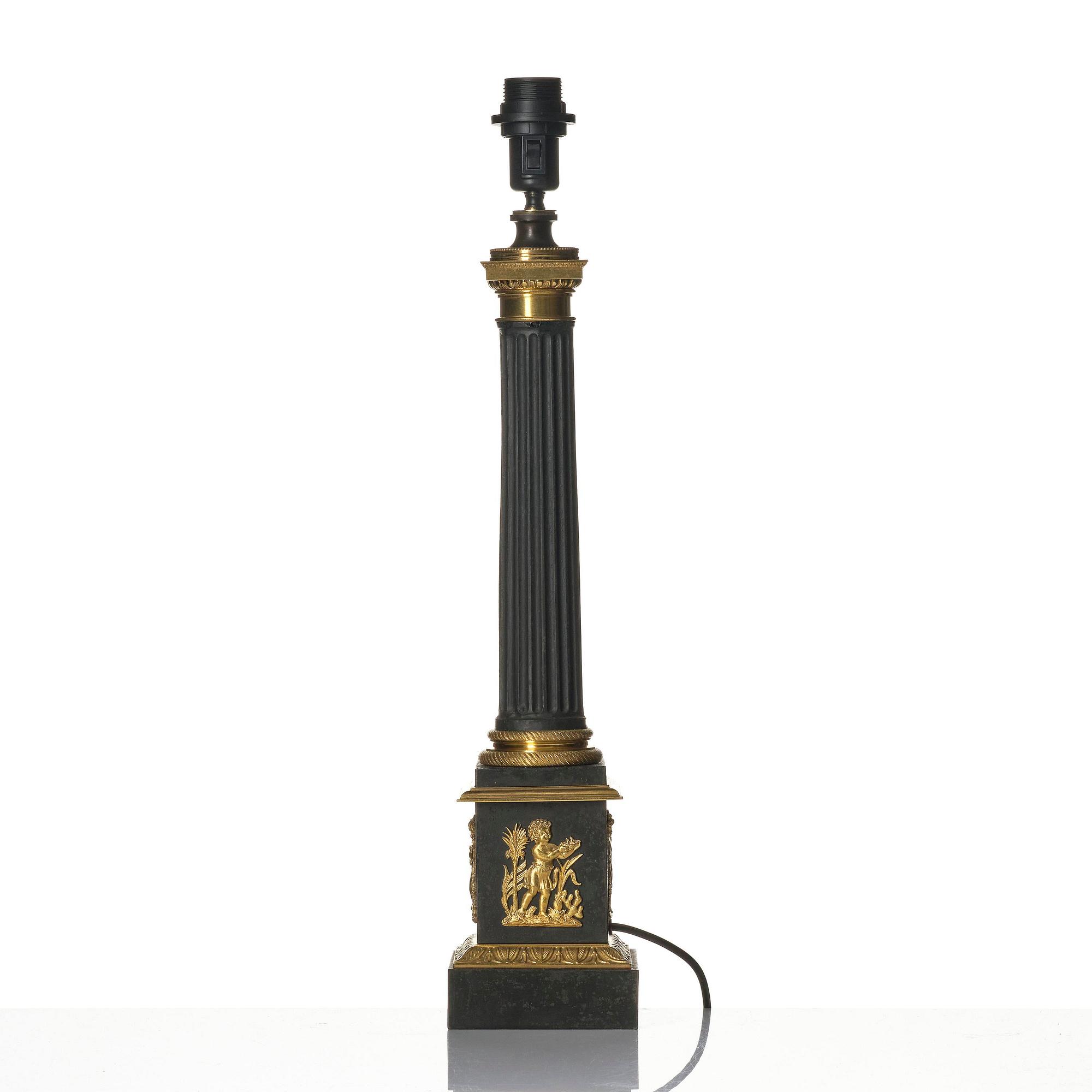 A French Empire ormolu and tole lamp, early 19th century.
