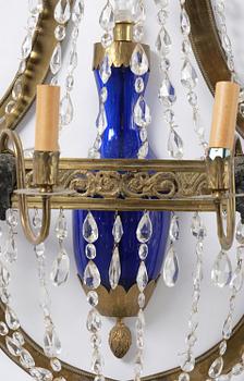 A pair of Russian Louis XVI-style  four-branch gilt bronze appliques, 19th century.