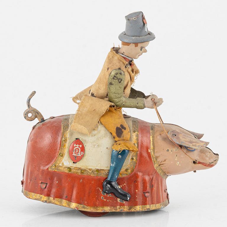 Lehmann, A tinplate 'Paddys dancing pig' Germany. In production 1903-35.